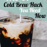 milk being poured into a glass of cold brew coffee with a gray background