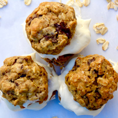 oatmeal cream pies with chocolate chips on parchment paper