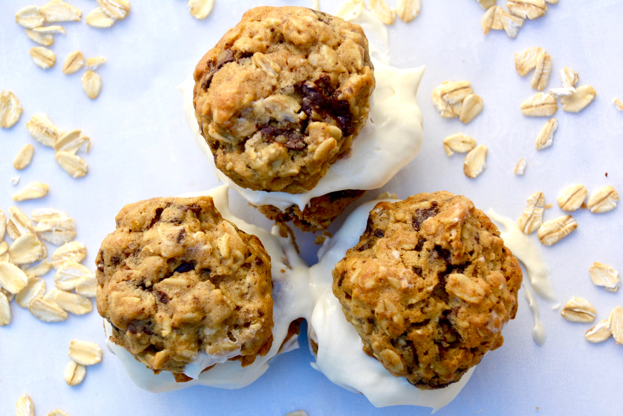 oatmeal cream pies with chocolate chips on parchment paper