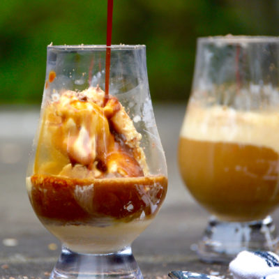 two affogatos on pavement outside with vanilla ice cream and espresso