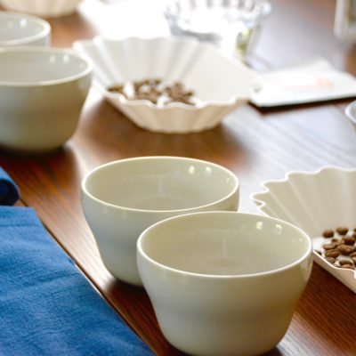 cupping coffee table set up with tasting trays and cups