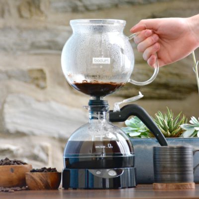 siphon coffee maker in use