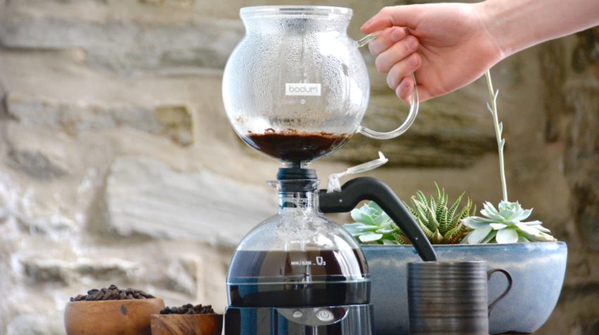 siphon coffee maker in use
