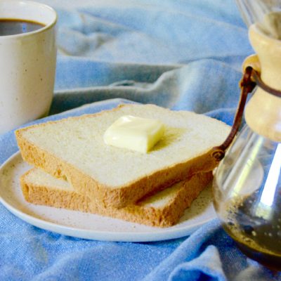 white bread with chemex and cup of coffee on a blue background