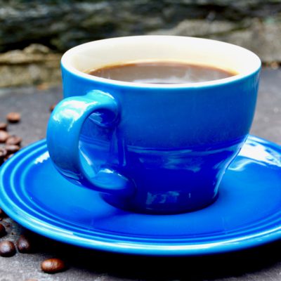 blue coffee cup and saucer cement